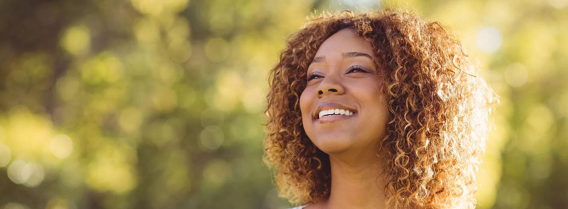 Patient smiling outdoors